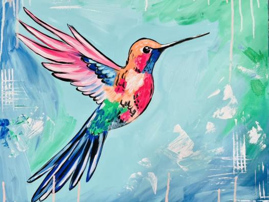 beautiful brightly colored hummingbird with blue/teal background