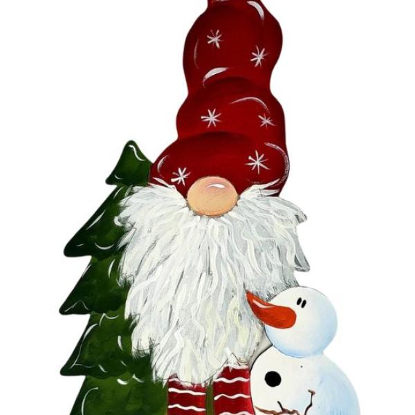painted wood cut out gnome with a red hat and red pants, a snowman is hugging the gnome and has a white body, black buttons, brown stick arm, and orange carrot nose. There is a bright green tree beside the gnome as well.